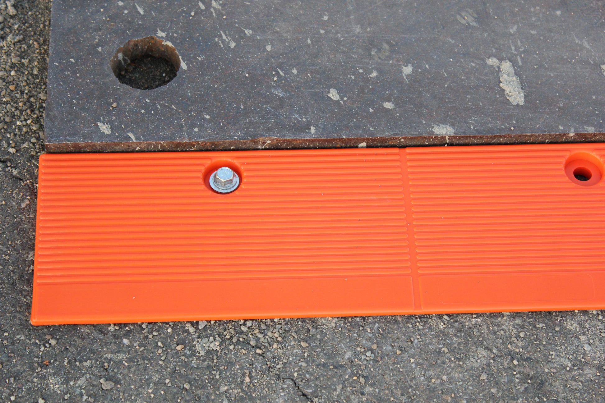 Close-up of the Plate Lock Stick’s textured surface and pre-drilled holes for anchoring.